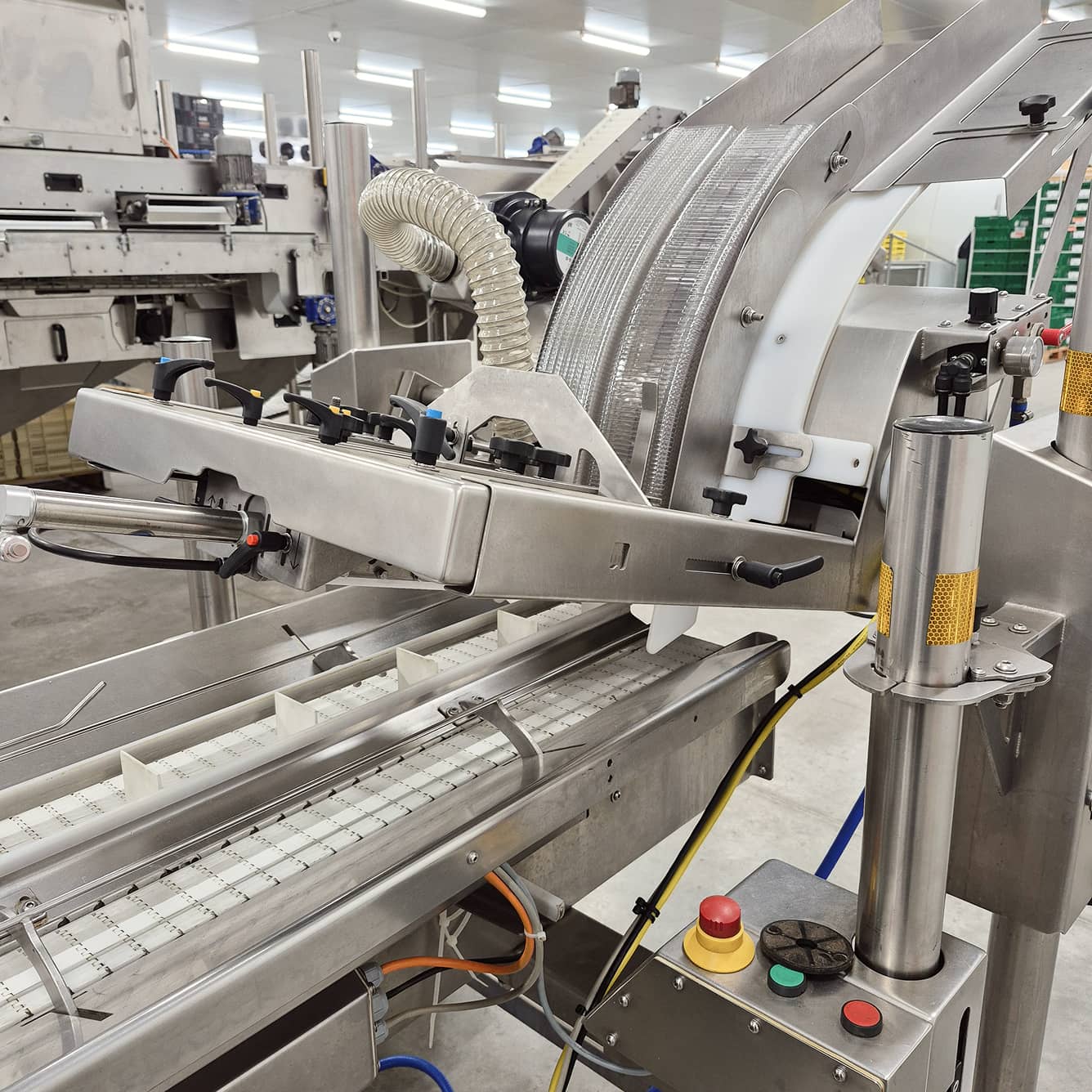 A denesting machine for packaging automation in packhouses.