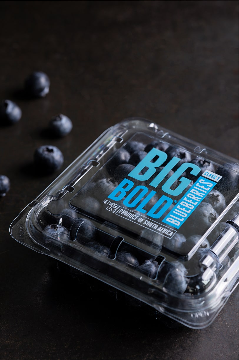 A flawlessly printed berry clamshell punnet expressing bespoke custom branded packaging solutions at Yucca Packaging.