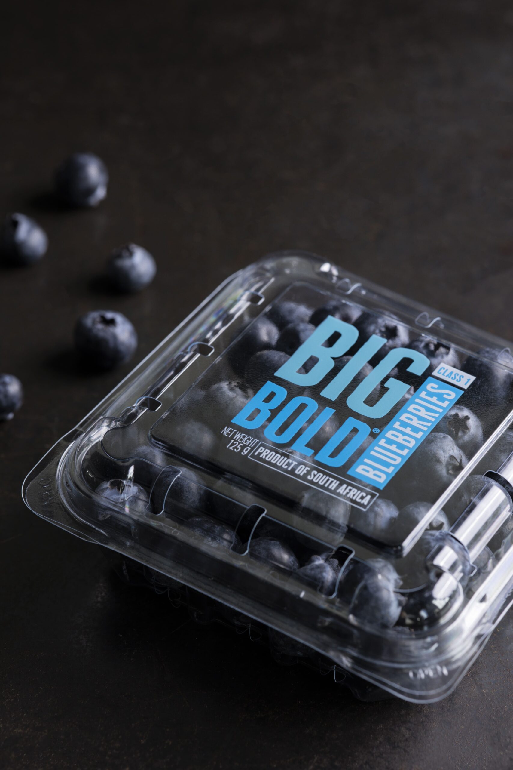 A branded print direct to blueberry punnet in 3 colors.