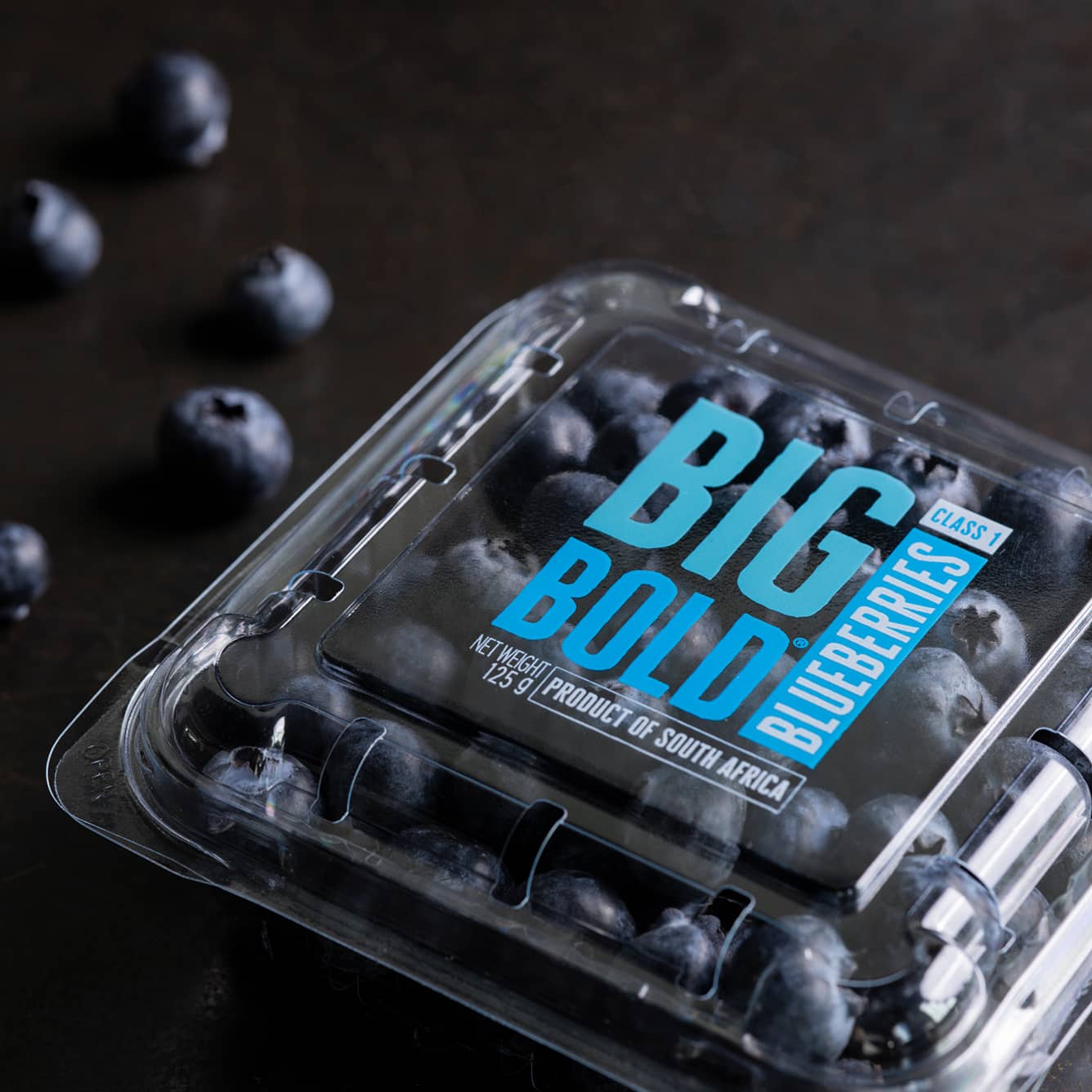 A Yucca Packaging berry punnet clamshell with printed branding and traceability.