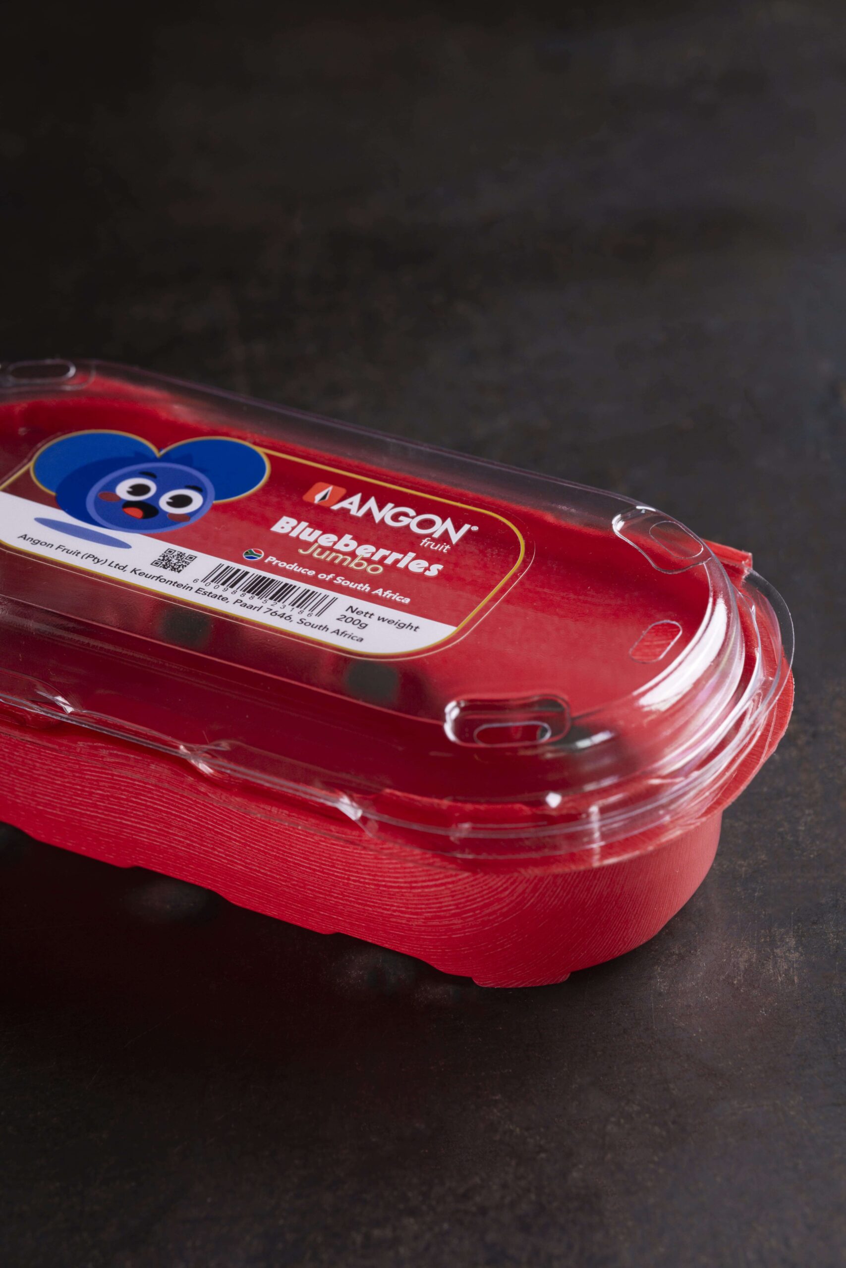 A Yucca Packaging punnet clamshell with custom label on it.