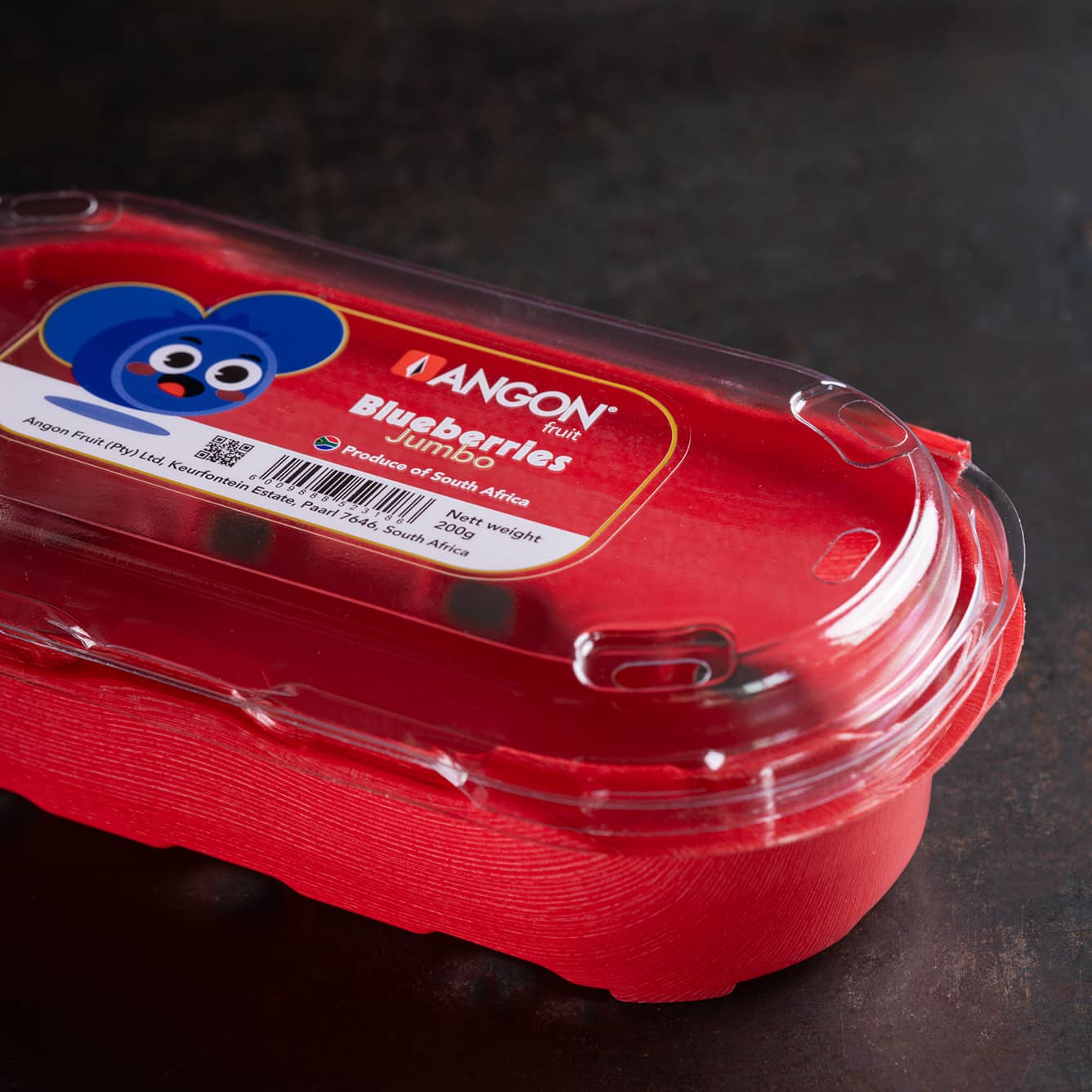 A Yucca Packaging punnet clamshell with custom label on it.