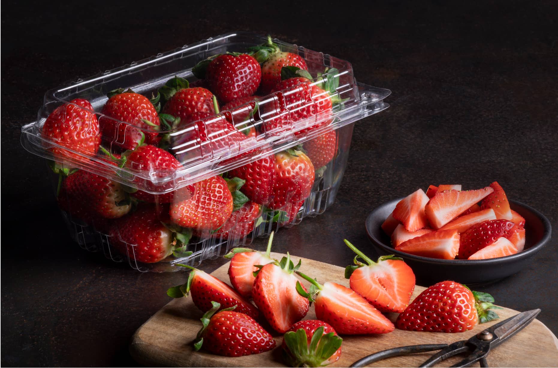 A Yucca Packaging plastic punnet clamshell packed with strawberries.